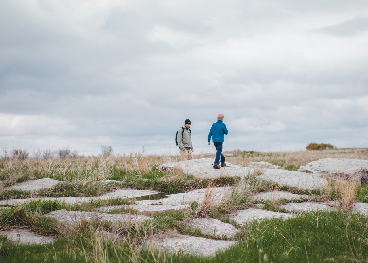 Man and boy in an open prairie
